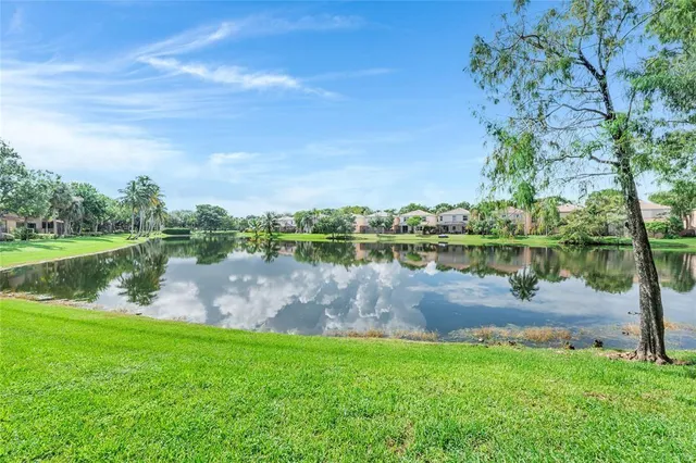 a view of a lake with a yard