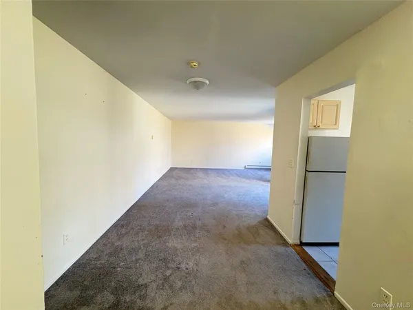 a view of a big room with wooden floor