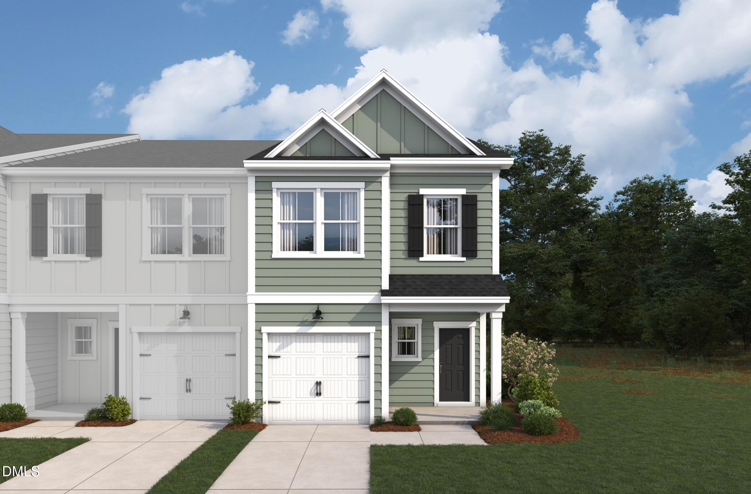 5028 Silver Brook Road Durham, NC 27703 - Photo 6 of 16 a front view of a house with garden