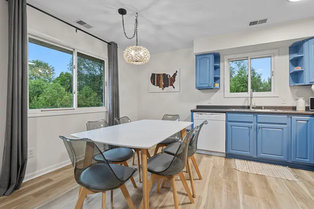 a view of a dining room with furniture window and wooden floor