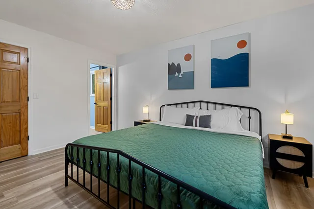 a bedroom with a bed and a window