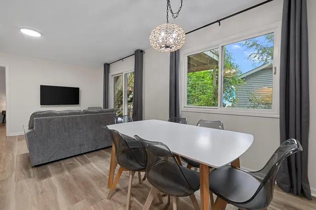 a view of a dining room with furniture window and outside view