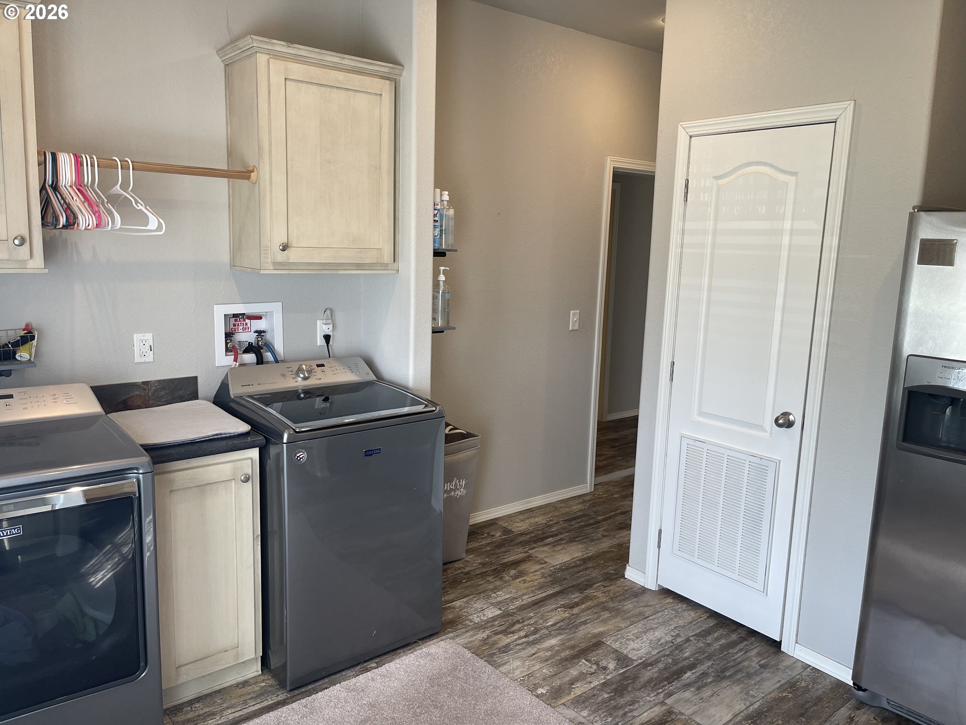 6404 Lookingglass Road Roseburg, OR 97471 - Photo 29 of 48 a utility room with cabinets washer and dryer