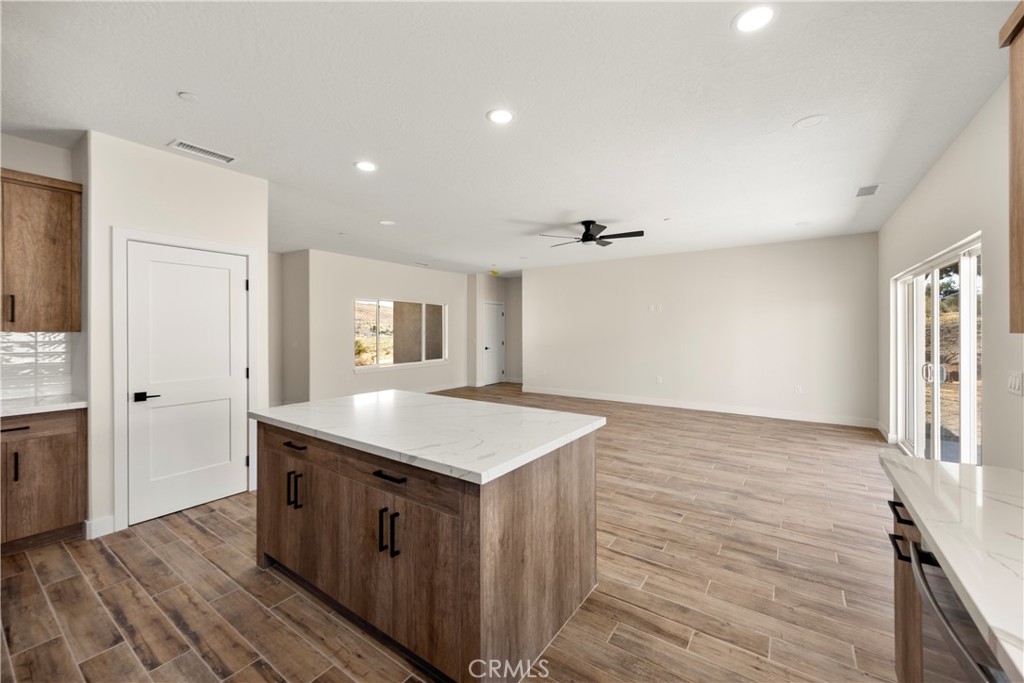 22324 Rancho Street Apple Valley, CA 92308 - Photo 21 of 47 a kitchen with a sink and cabinets
