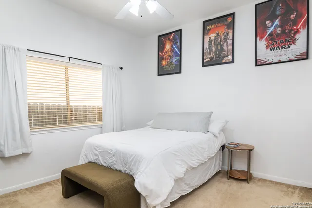 a bedroom with a bed and a couch