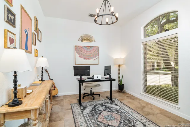a work room with furniture and a window