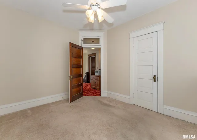 a view of a dining room with furniture and window