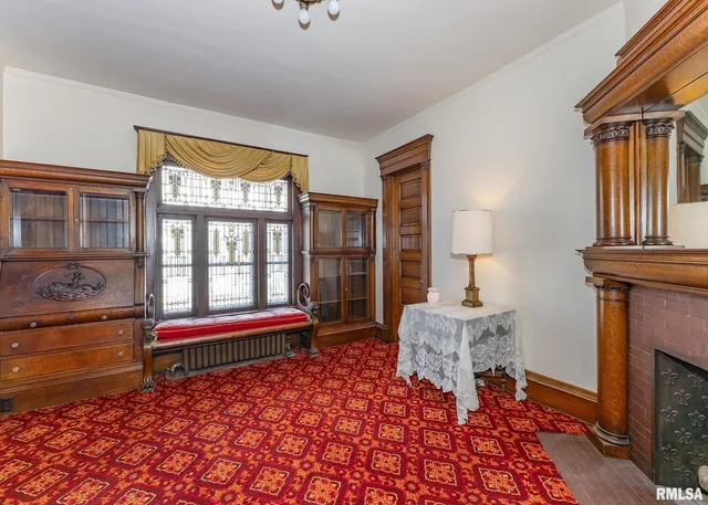 a view of room with window and chandelier fan
