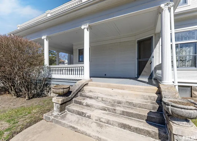 a bedroom with furniture and window