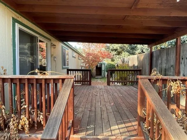 a balcony with wooden floor