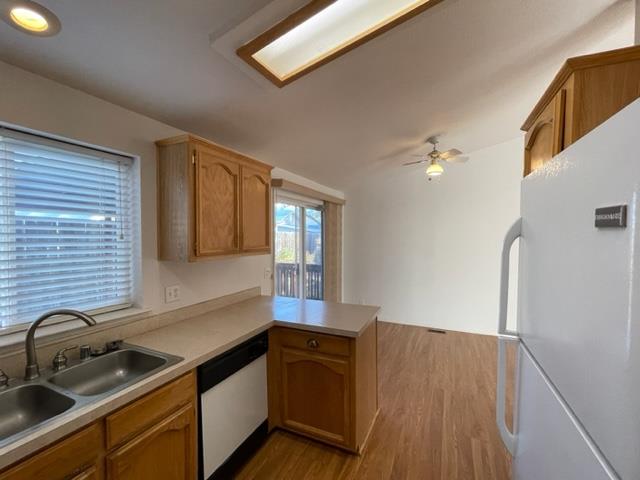 166 Oak Tree Circle Murphys, CA 95247 - Photo 6 of 21 a kitchen that has a sink and a stove