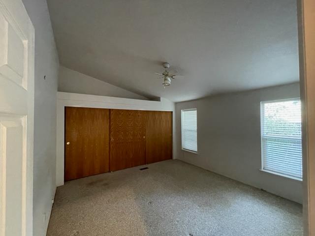 166 Oak Tree Circle Murphys, CA 95247 - Photo 7 of 21 an empty room with windows