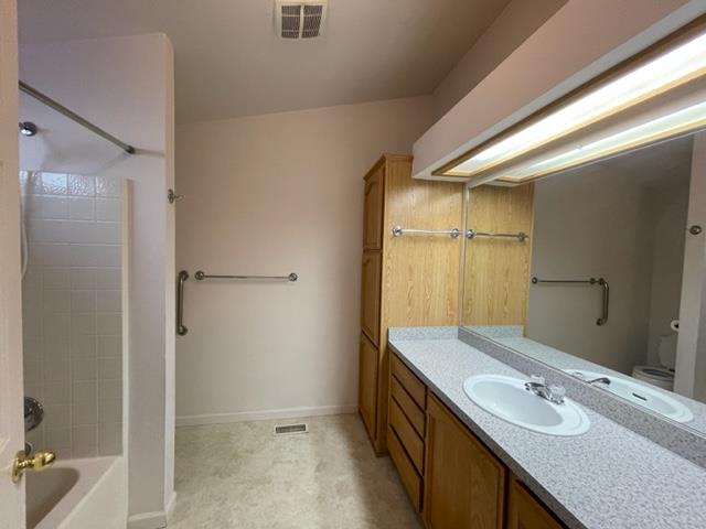 166 Oak Tree Circle Murphys, CA 95247 - Photo 9 of 21 a bathroom with a granite countertop sink and a mirror