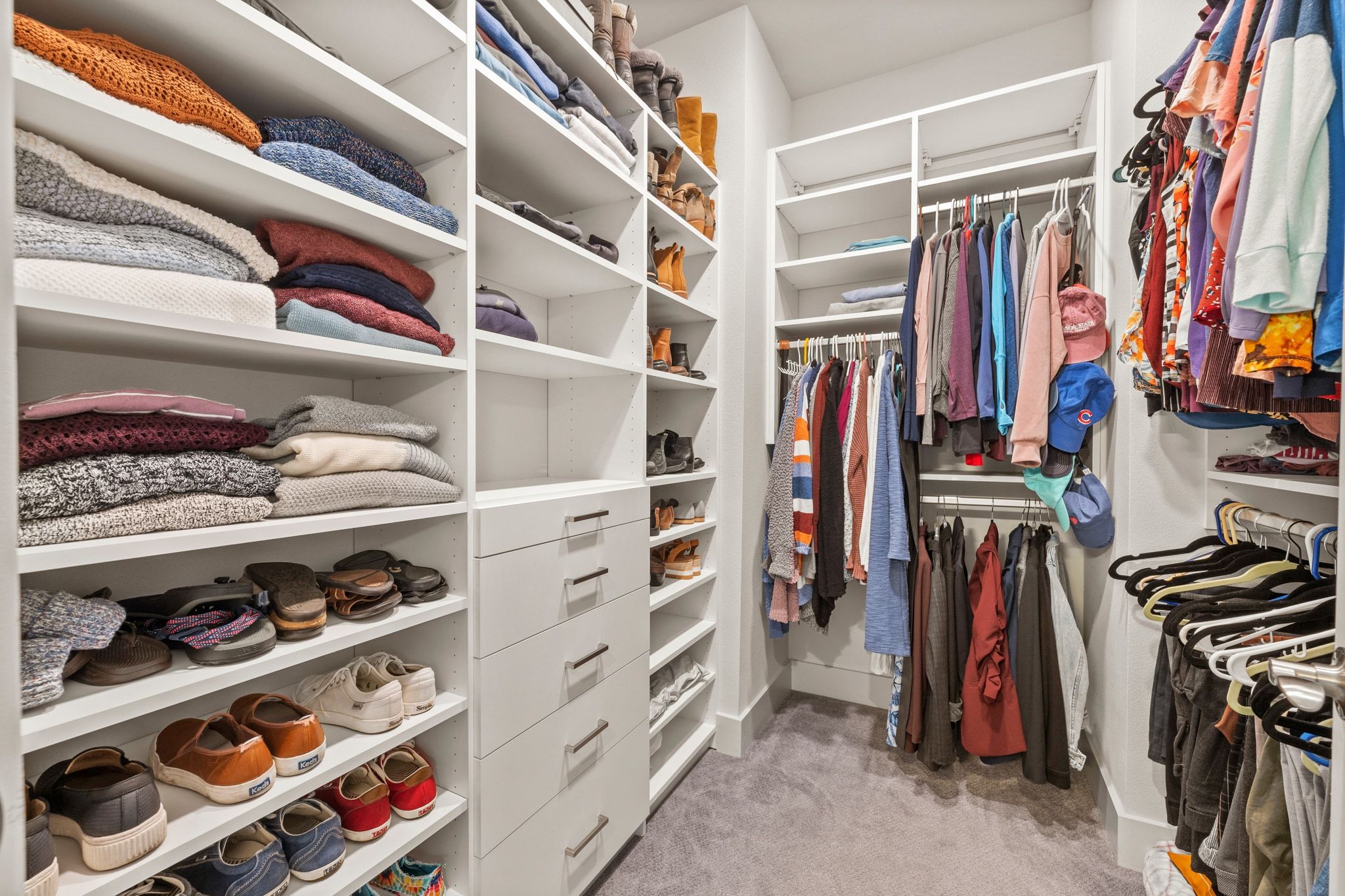 8110 Ranch Road 2222, Unit 92 Austin, TX 78730 - Photo 37 of 40 Custom closet system featuring extensive shelving, multiple hanging rods, and built-in drawers