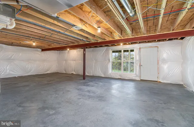 a view of a room with wooden walls