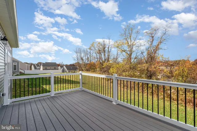 a view of a balcony with wooden fence