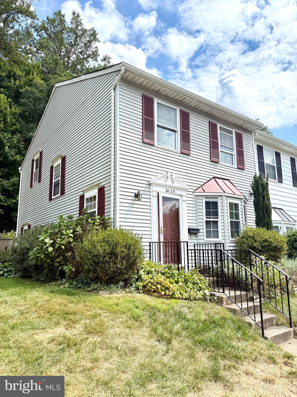 6029 Selwood Place Springfield, VA 22152 - Photo 2 of 16 a front view of a house with a yard