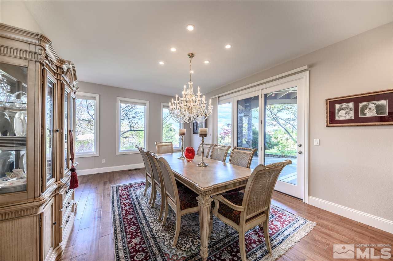 10 Sharps Circle Reno, NV 89519 - Photo 6 of 21 a view of a dining room with furniture wooden floor and a chandelier