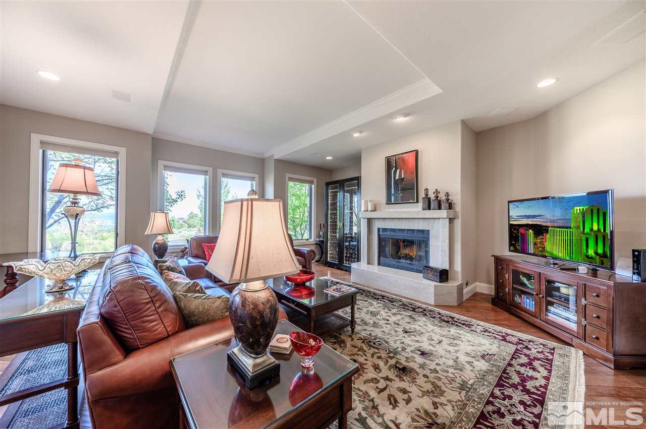 10 Sharps Circle Reno, NV 89519 - Photo 10 of 21 a living room with furniture a flat screen tv and a fireplace