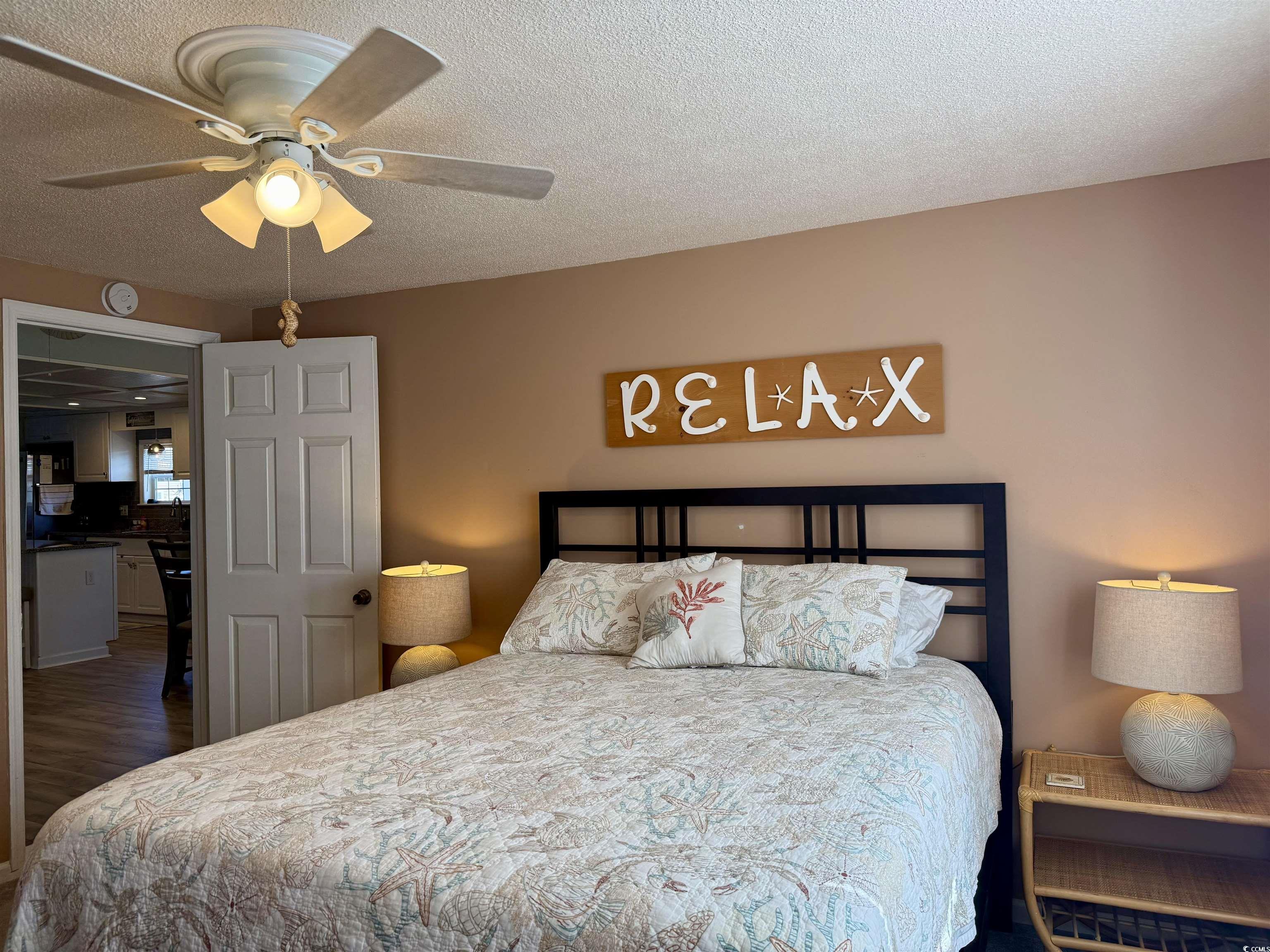 427 Meadowlark Surfside Beach, SC 29575 - Photo 9 of 33 Bedroom featuring a textured ceiling and ceiling fan