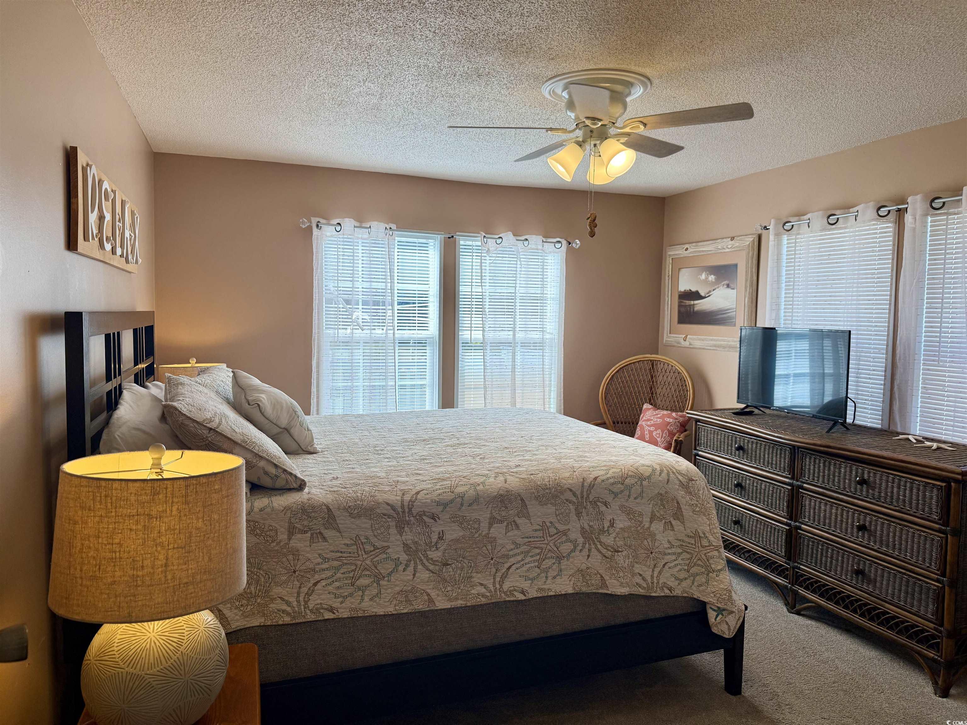 427 Meadowlark Surfside Beach, SC 29575 - Photo 8 of 33 Bedroom with a textured ceiling, a ceiling fan, and carpet flooring