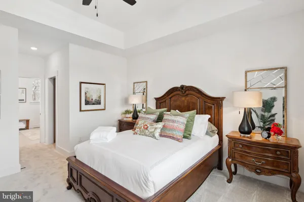 a bedroom with a bed and a dresser