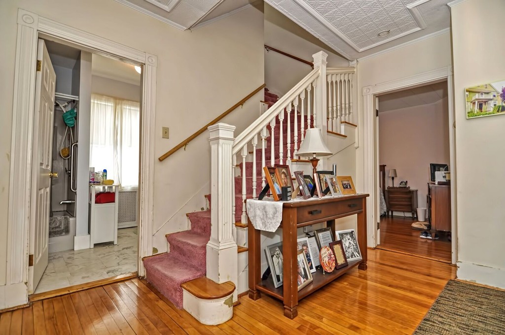40-42 Mapleton Street Boston, MA 02135 - Photo 14 of 17 a view of entryway dining room and hall with wooden floor