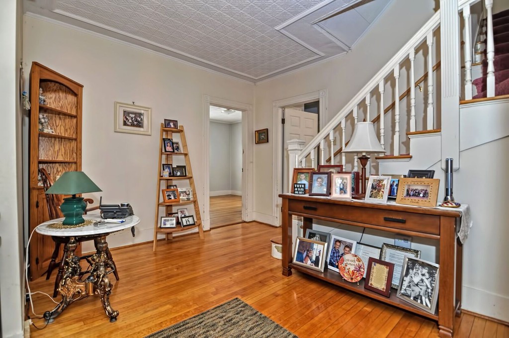 40-42 Mapleton Street Boston, MA 02135 - Photo 16 of 17 a living room with furniture and wooden floor