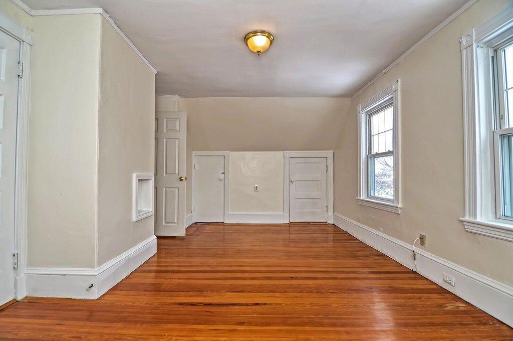 40-42 Mapleton Street Boston, MA 02135 - Photo 10 of 17 a view of a room with window and wooden floor