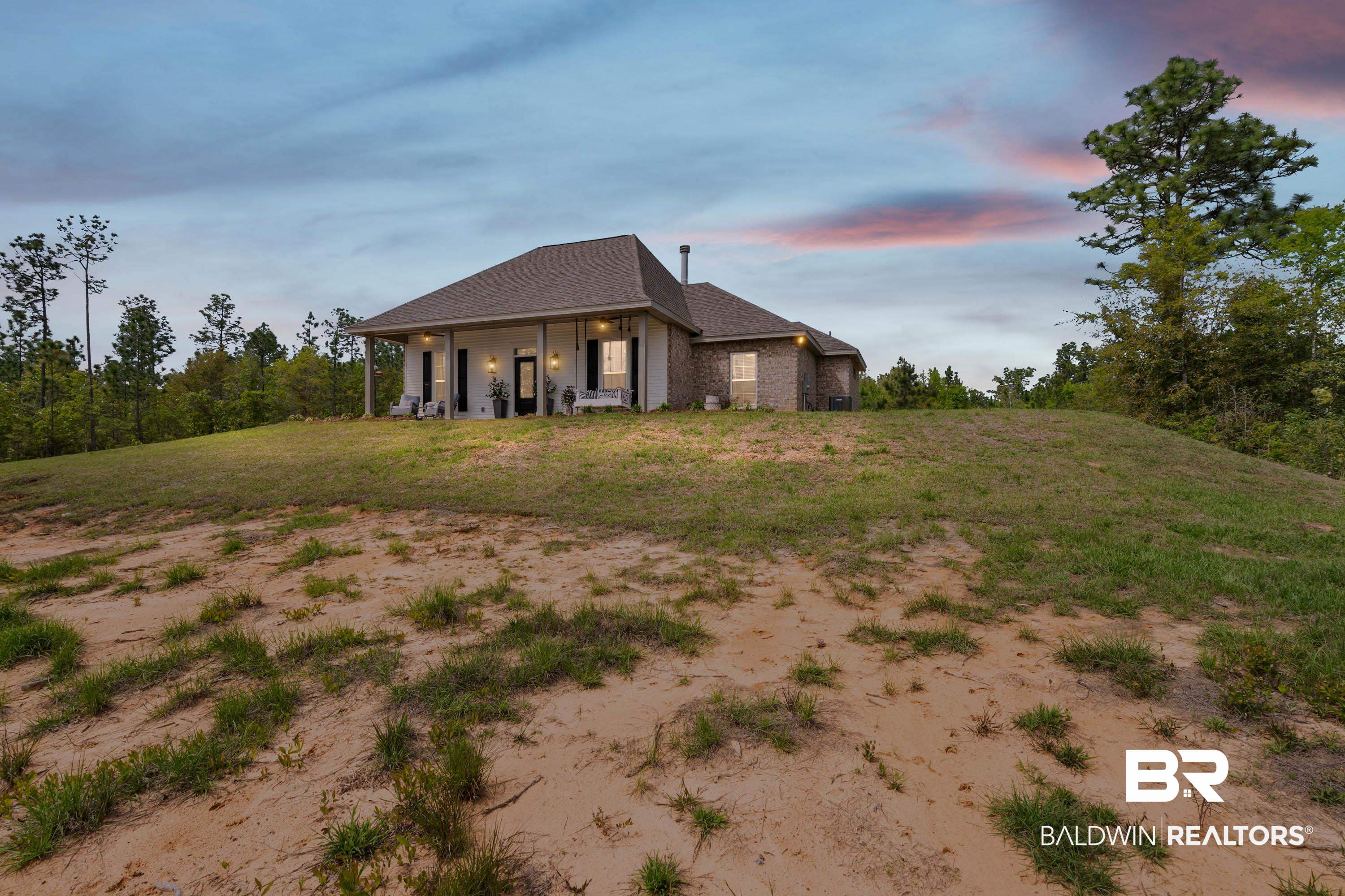 7150 Powell Road, Unit LOT 6A Eight Mile, AL 36613 - Photo 3 of 35 Back of house with roof with shingles, a yard, and brick siding