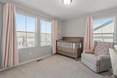 a living room with furniture and windows