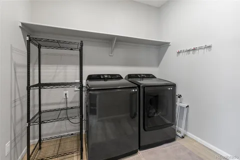 a utility room with washer and dryer