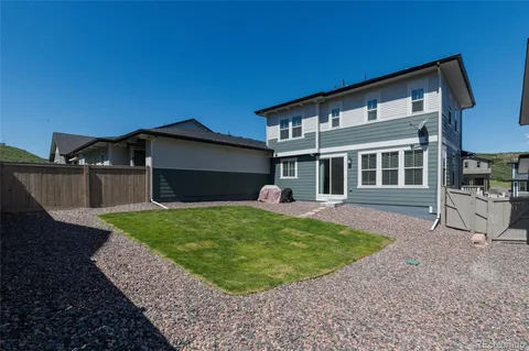 a front view of a house with a yard and porch