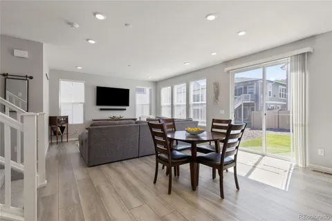 a view of a dining room with furniture window and wooden floor