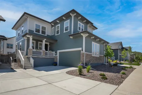a front view of a house with sitting area