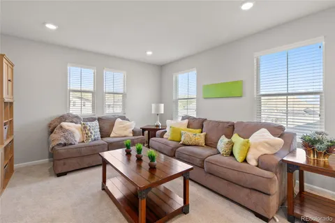 a living room with furniture and windows