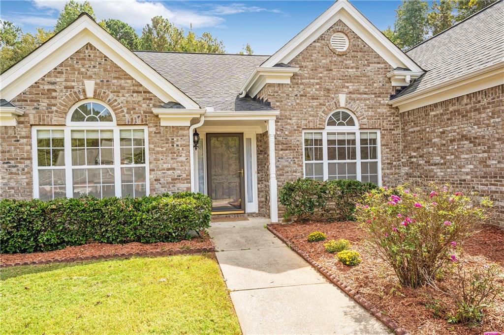 front view of a house with a yard