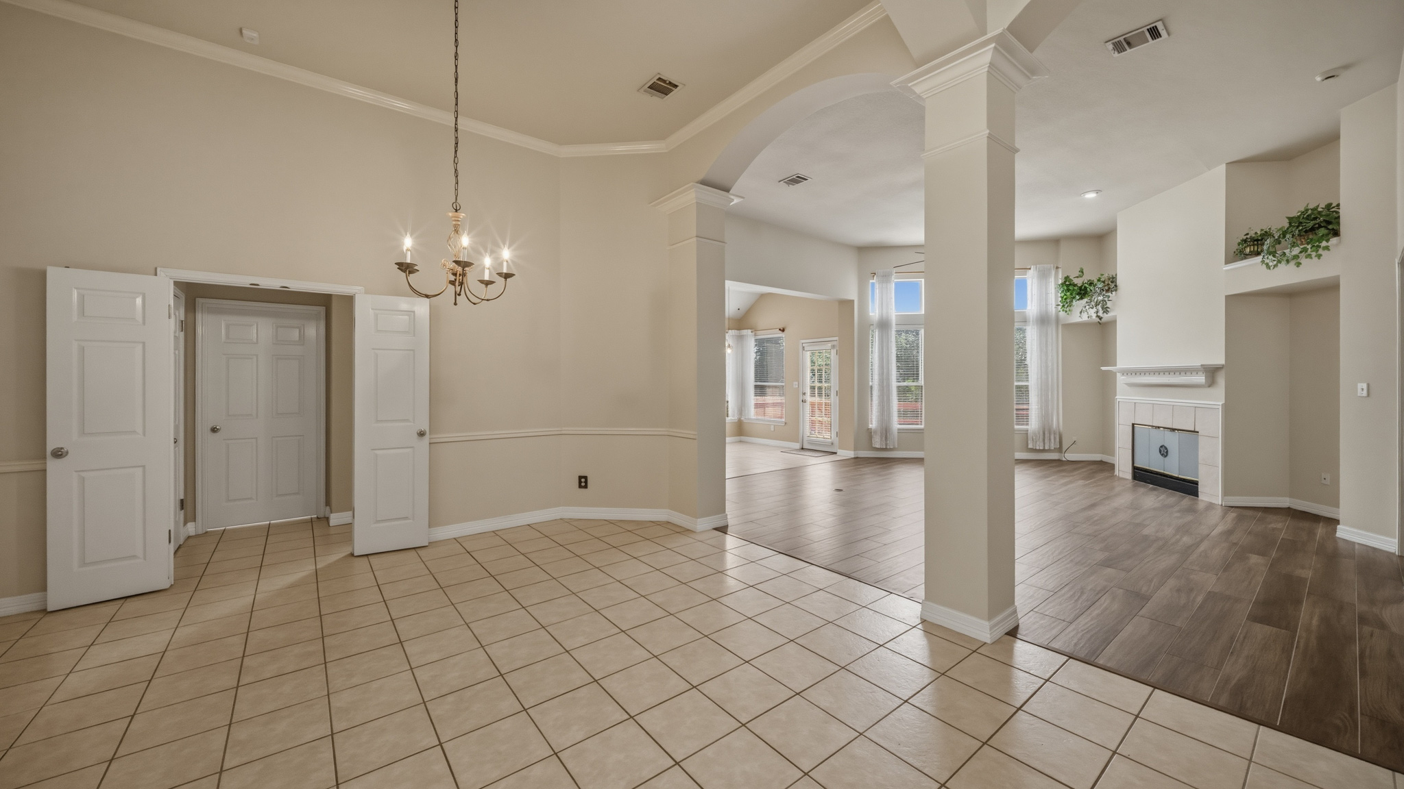1108 Antelope Ridge Cedar Park, TX 78613 - Photo 27 of 27 An open floorplan with diverse flooring and an elegant chandelier creates a welcoming living space.