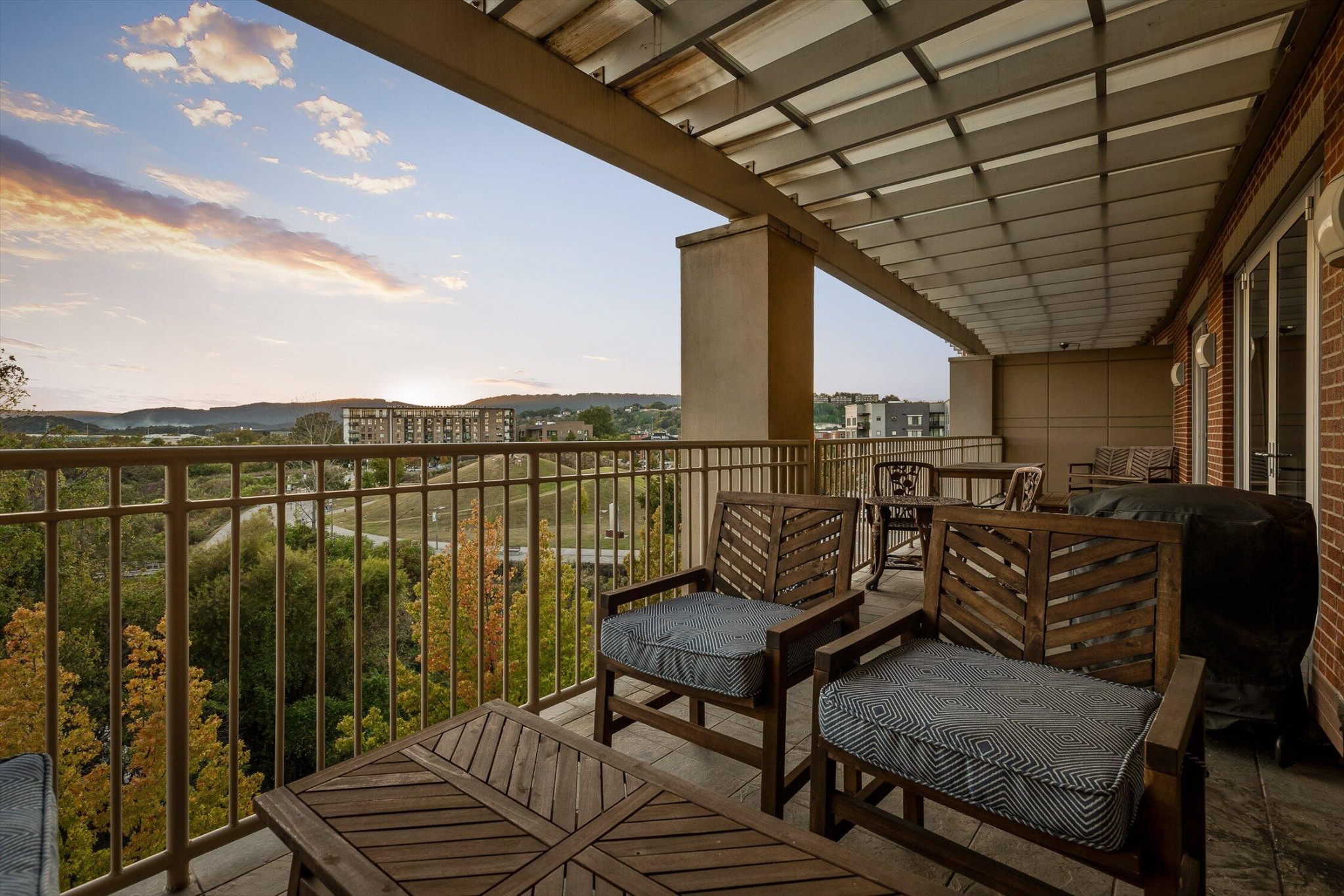 4 Cherokee Blvd., Unit 409 Chattanooga, TN 37405 - Photo 27 of 36 a view of a chairs in wooden deck