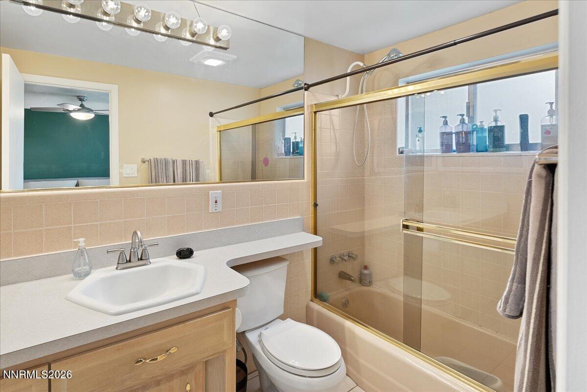 2205 Carlin Street Reno, NV 89503 - Photo 21 of 51 a bathroom with a sink a toilet and shower