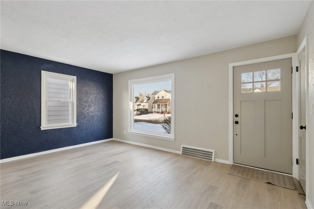 21316 Watson Road Maple Heights, OH 44137 - Photo 2 of 23 Entrance foyer with a textured wall and wood finished floors