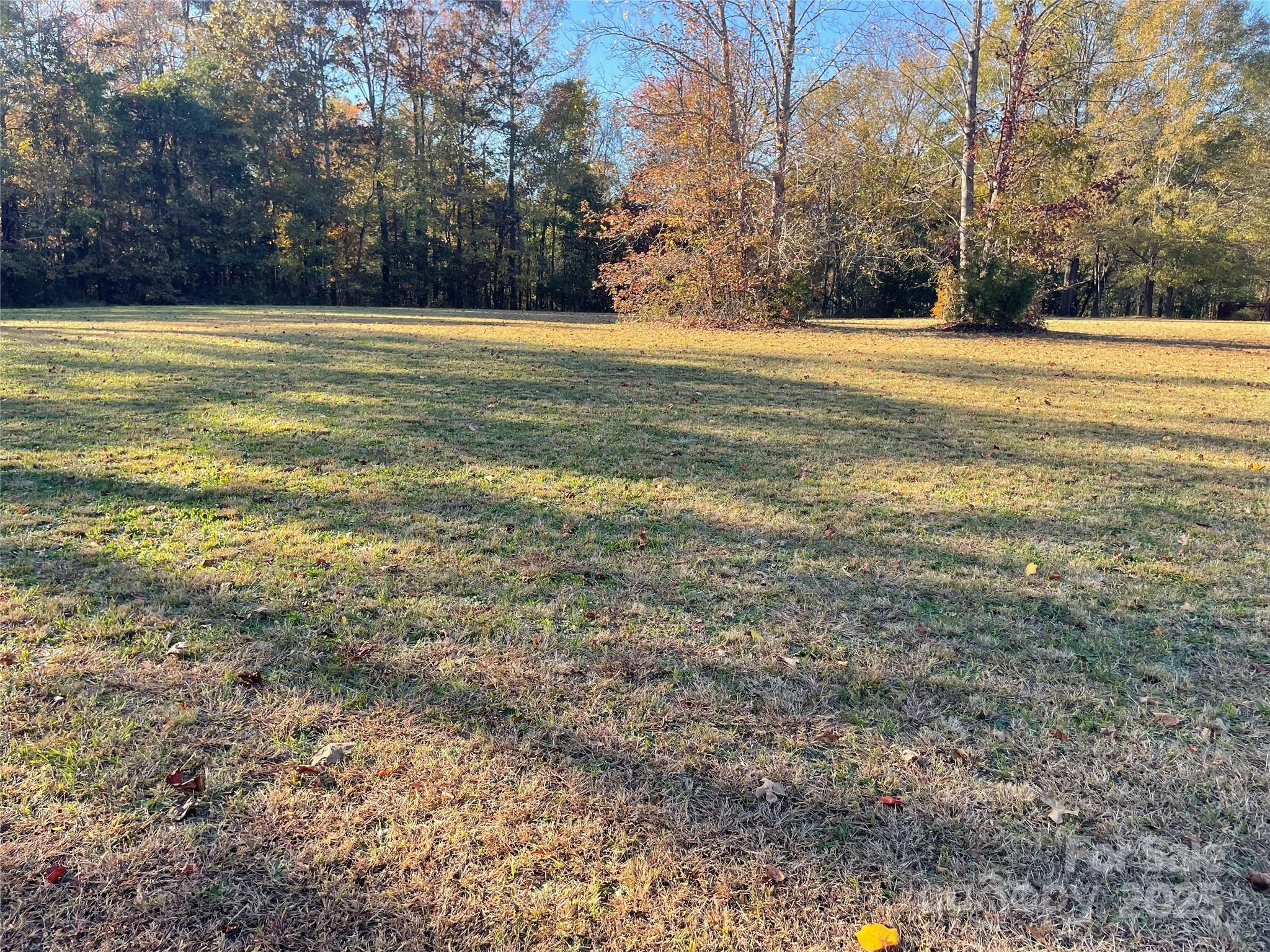 2865 Lentz Road China Grove, NC 28023 - Photo 5 of 16 a view of a field with an trees