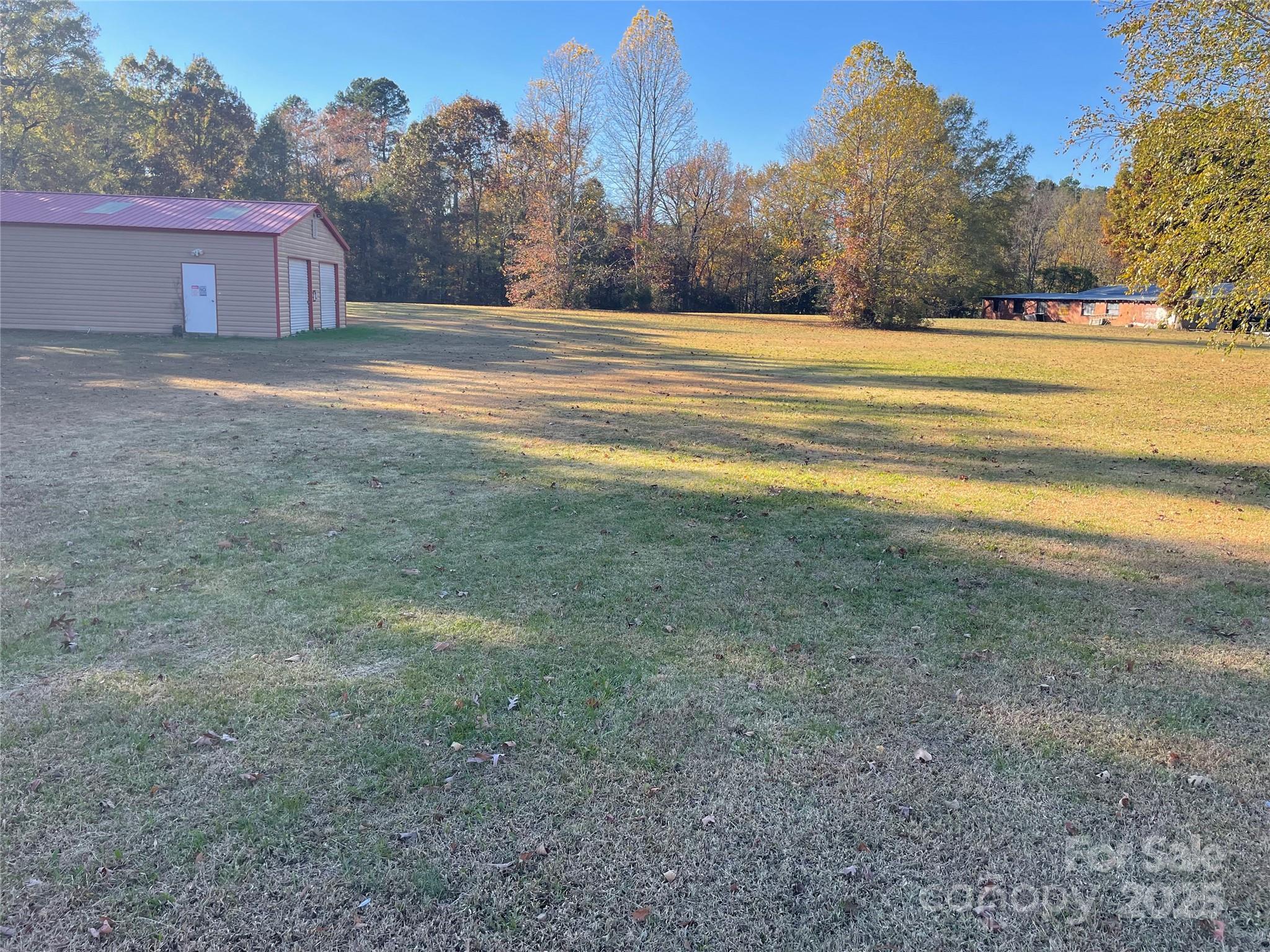 2865 Lentz Road China Grove, NC 28023 - Photo 6 of 16 a view of a yard with a large tree