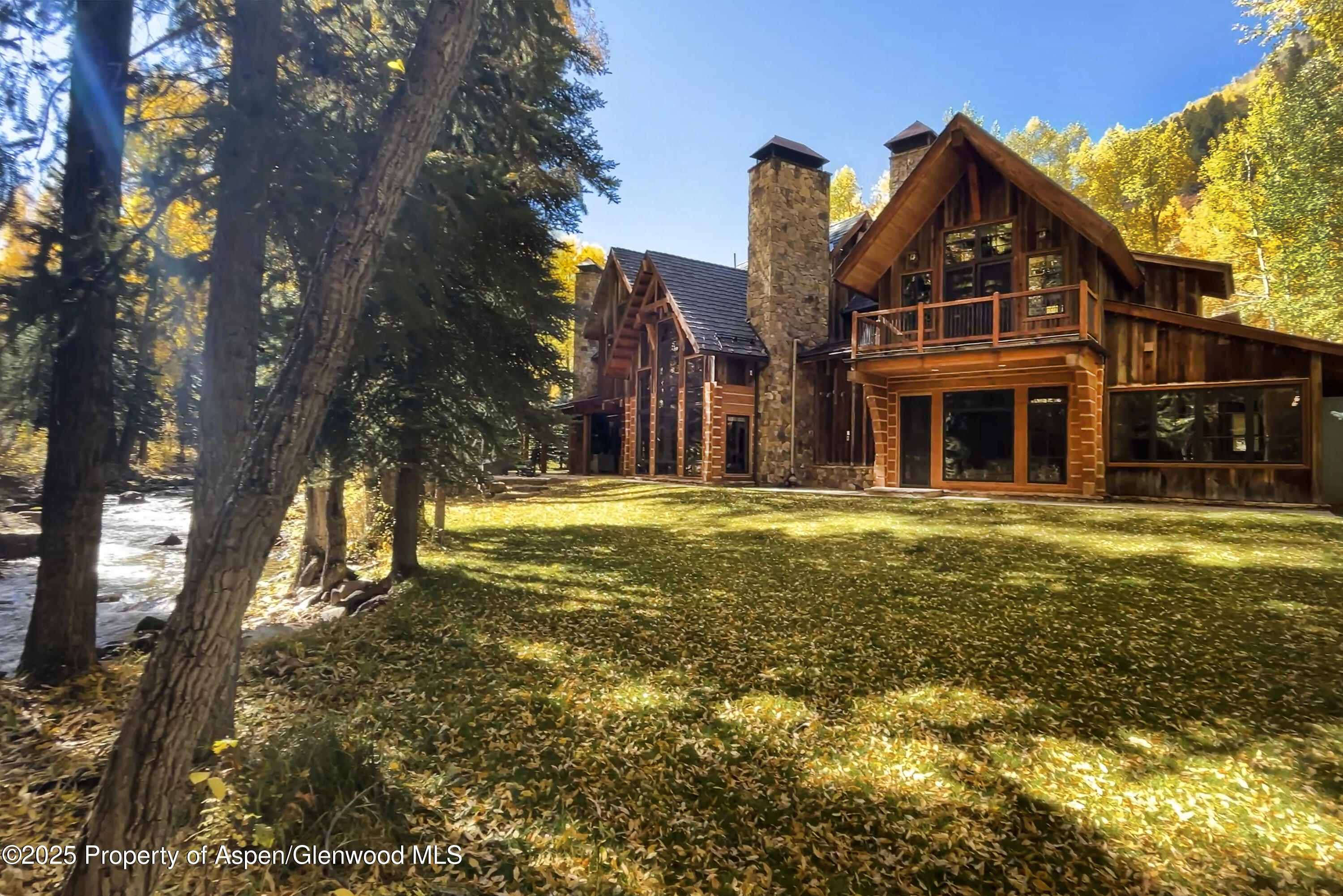 143 Conundrum Creek Road Aspen, CO 81611 - Photo 1 of 19 a front view of a house with a yard