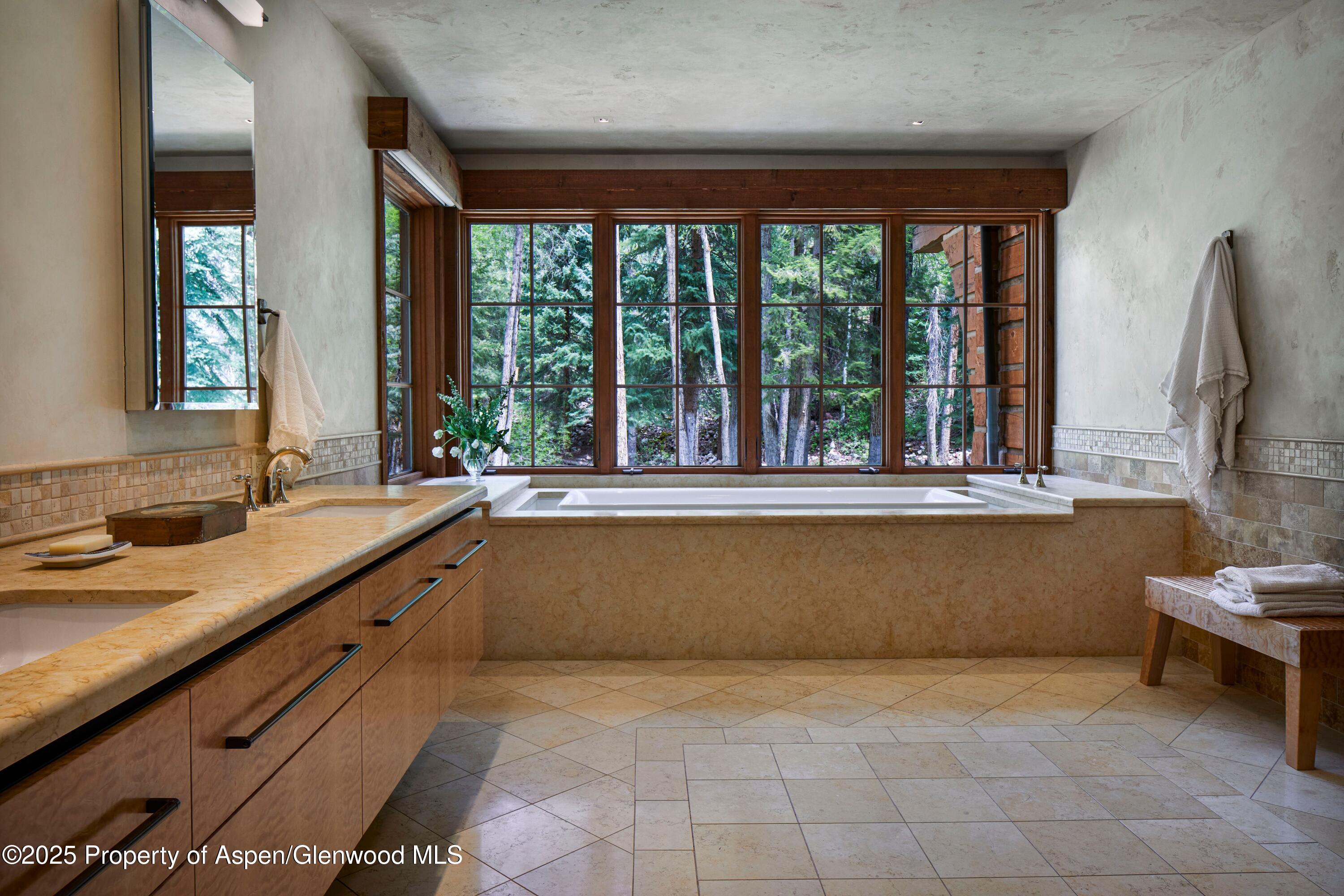 143 Conundrum Creek Road Aspen, CO 81611 - Photo 13 of 19 a view of a kitchen with a sink and a large window