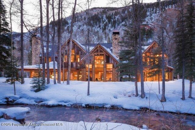 143 Conundrum Creek Road Aspen, CO 81611 - Photo 4 of 19 a street sign on a sidewalk next to a building