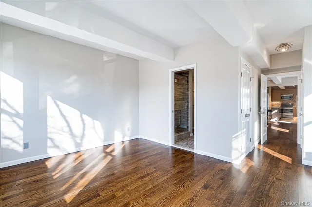 a bedroom with a bed and a potted plant
