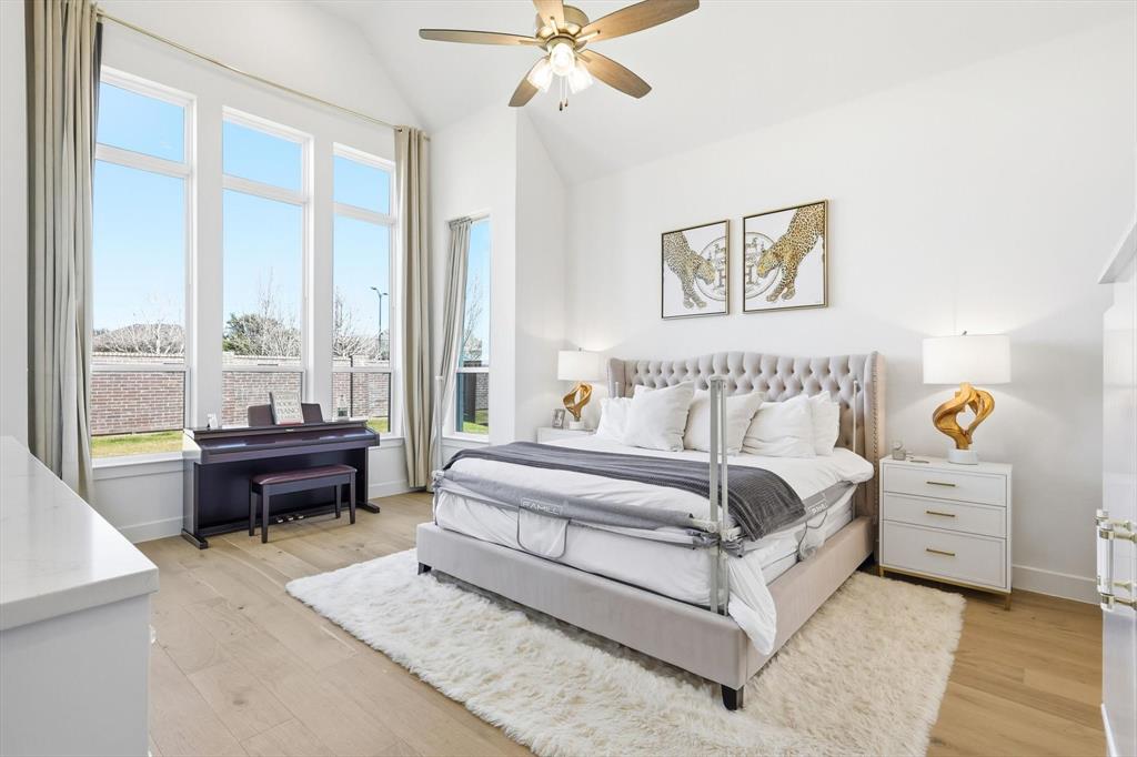 16194 Inca Dove Court Frisco, TX 75035 - Photo 15 of 40 Primary Bedroom featuring upgraded wood flooring, tall ceilings and an extended Sitting Area.