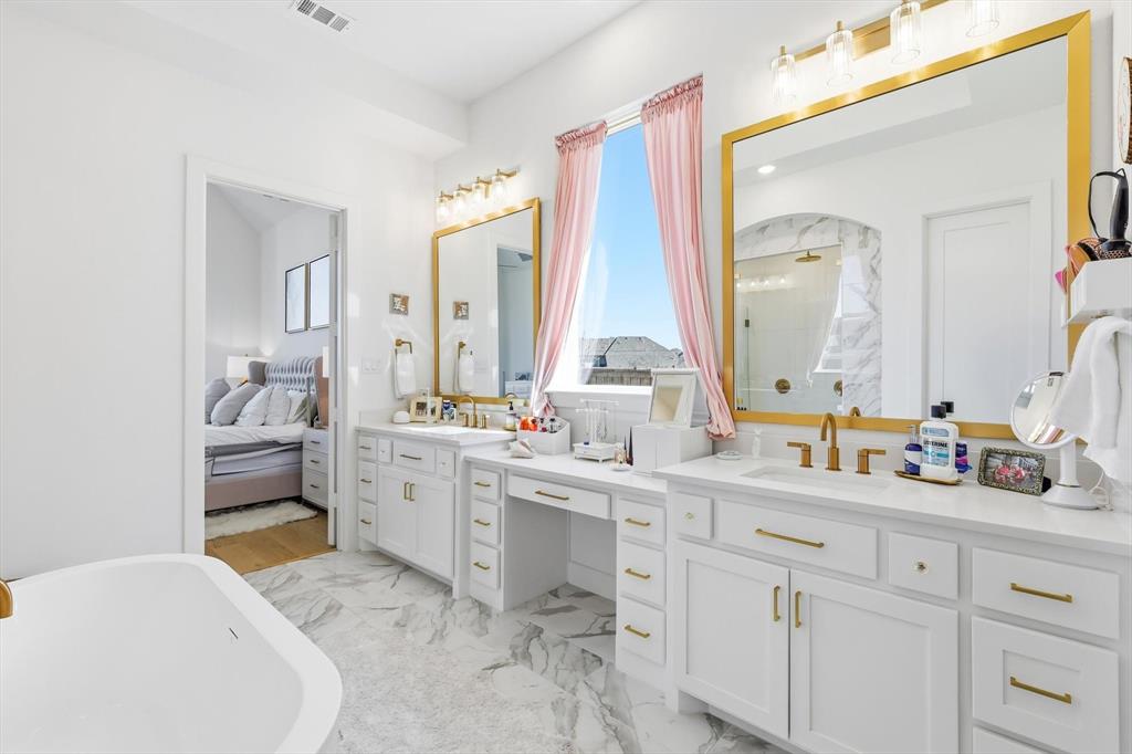16194 Inca Dove Court Frisco, TX 75035 - Photo 18 of 40 Primary Bath with Upgraded gold fixtures, hardware and framed mirrors.
