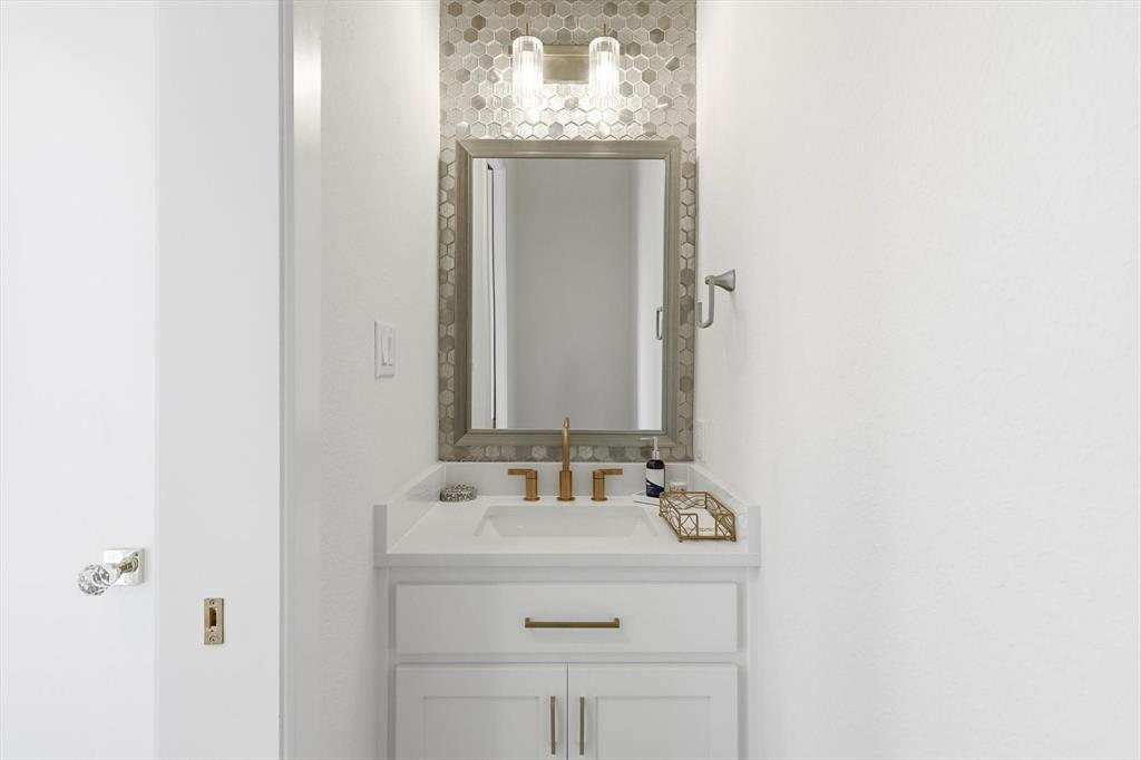 16194 Inca Dove Court Frisco, TX 75035 - Photo 23 of 40 Powder Room conveniently located by living area and rear yard.